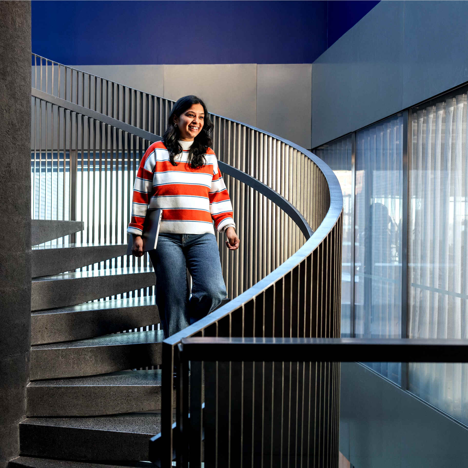 Person at Metacore walking down the stairs